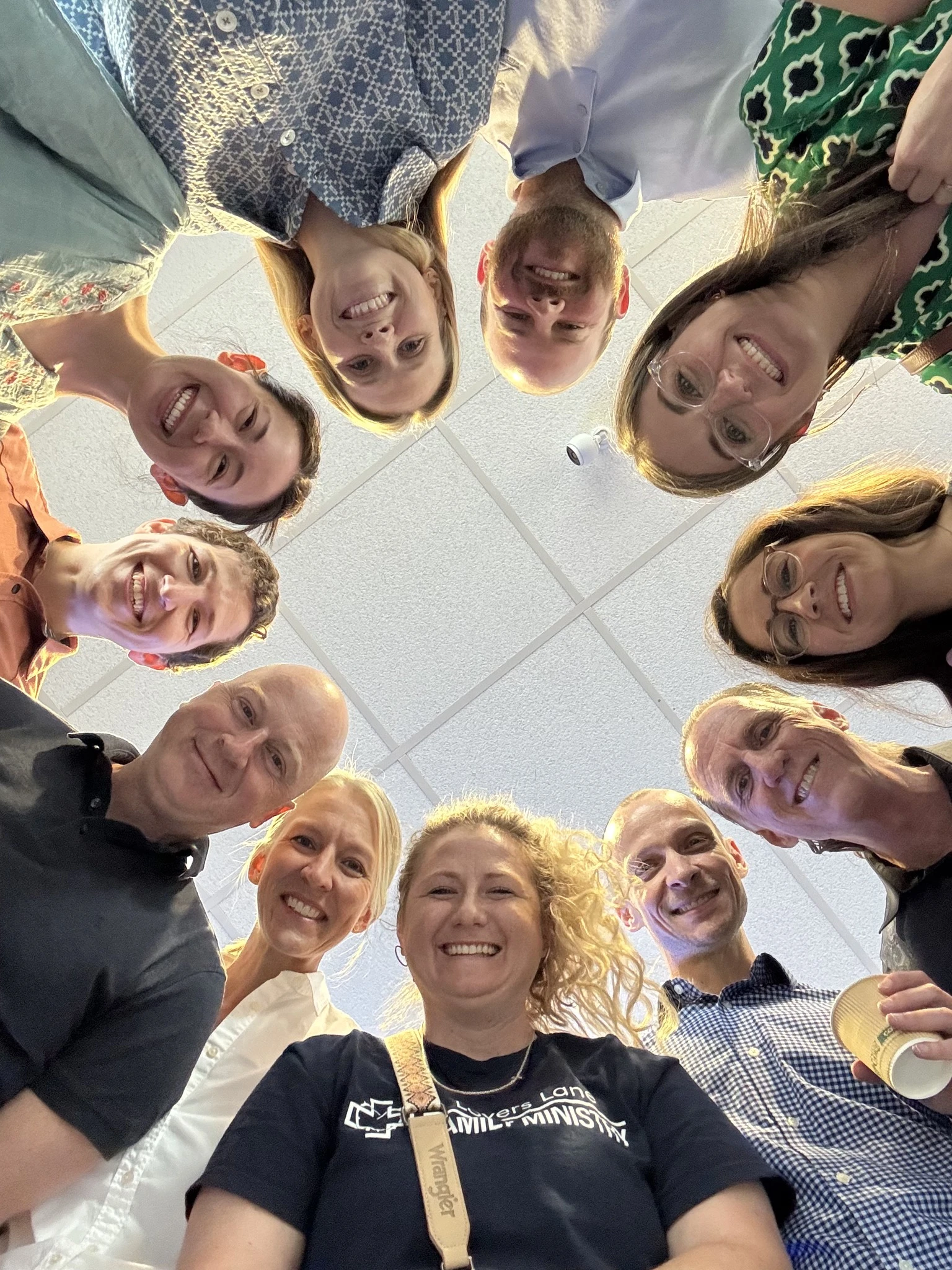 A circle of smiling faces from Lovers Lane adult ministries