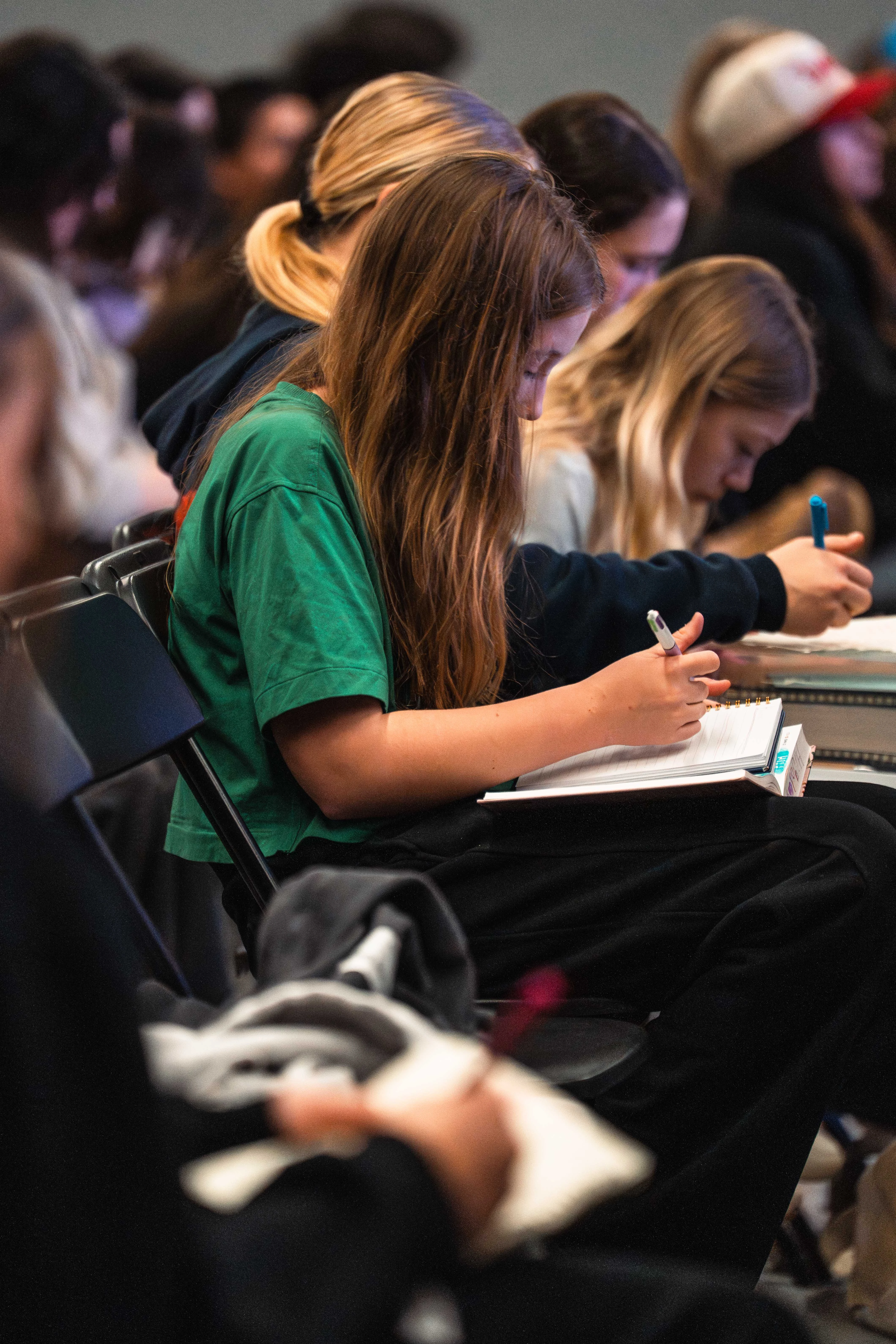 Middle school students listening to teaching