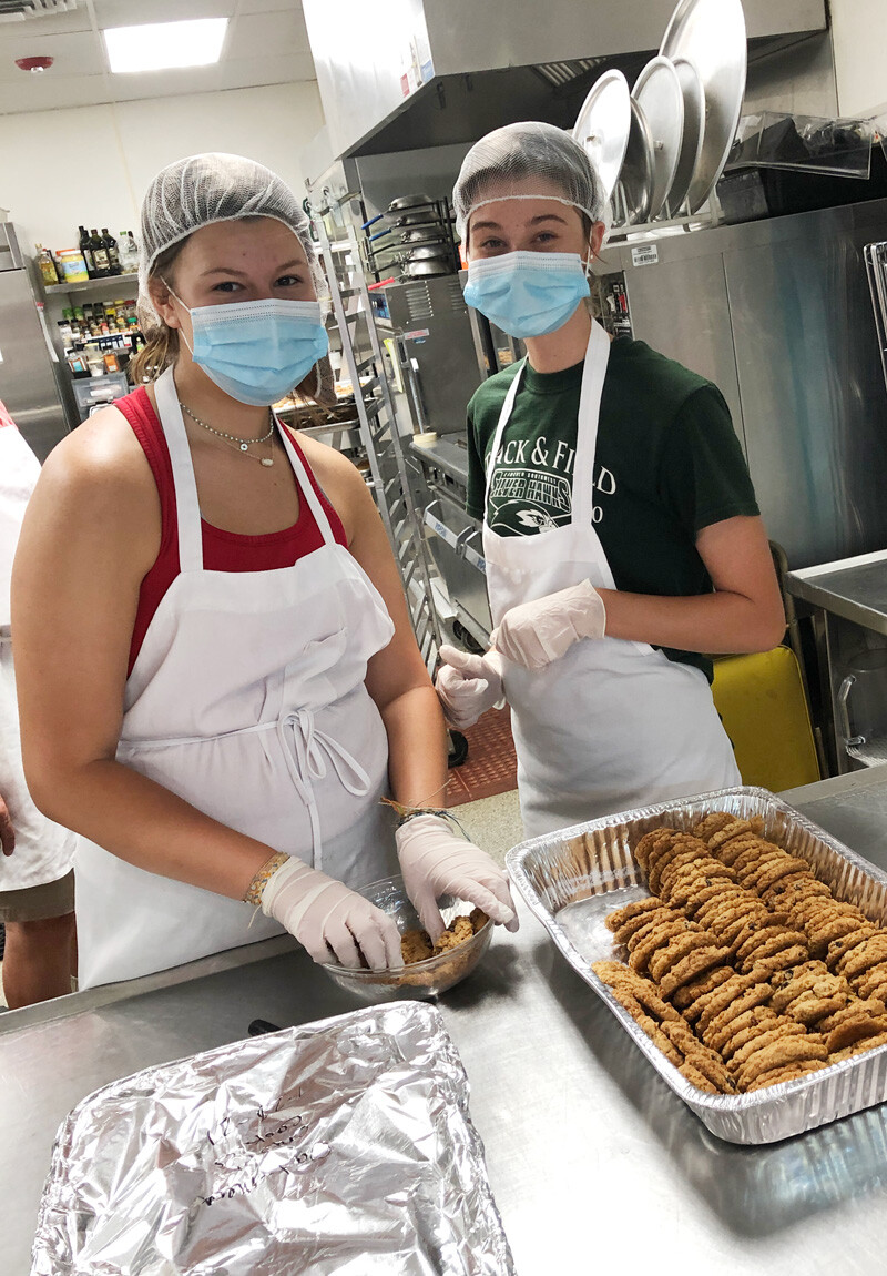 photo: youth serving cookies