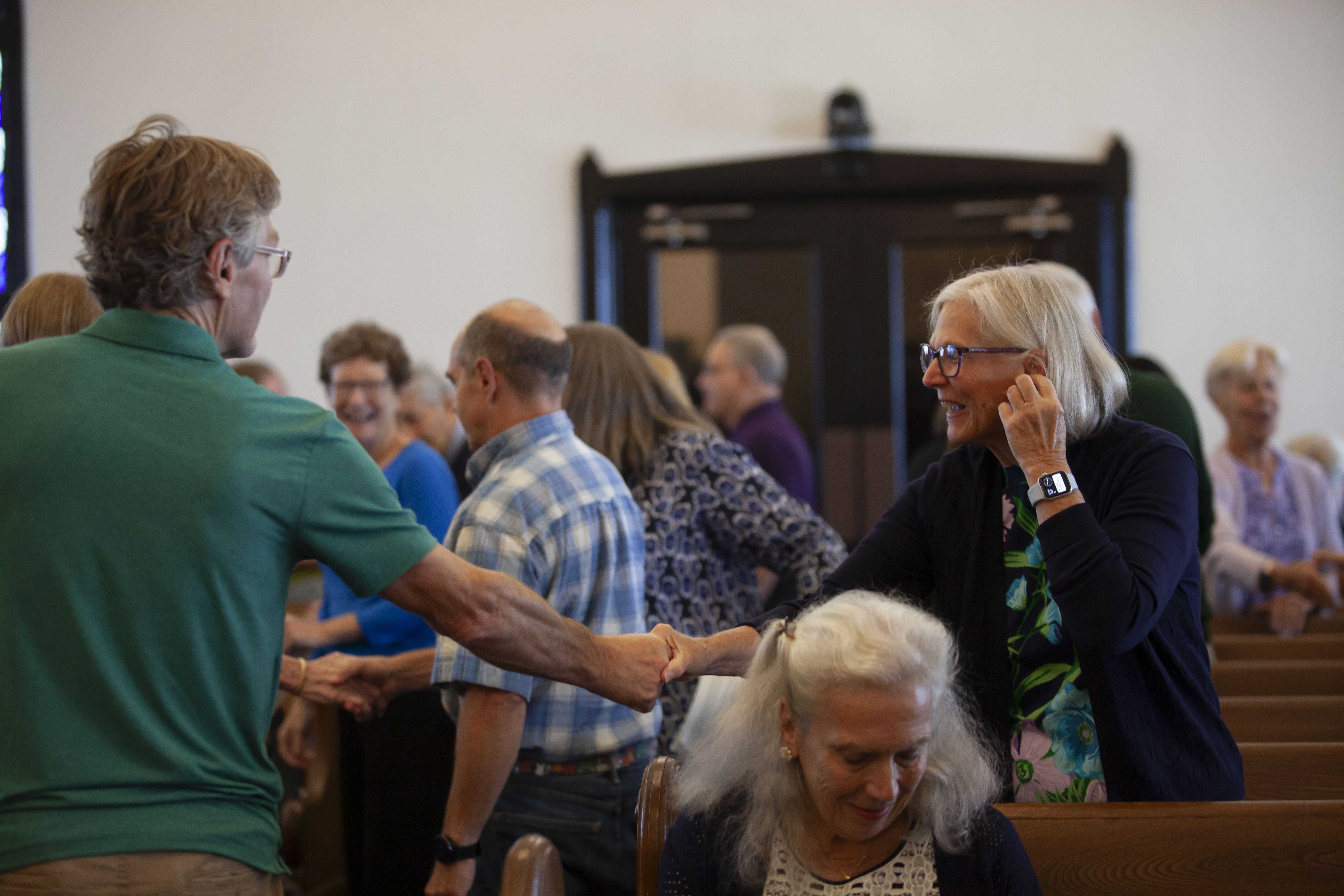 People greeting each other in worship