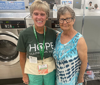 smiling at the laundromat