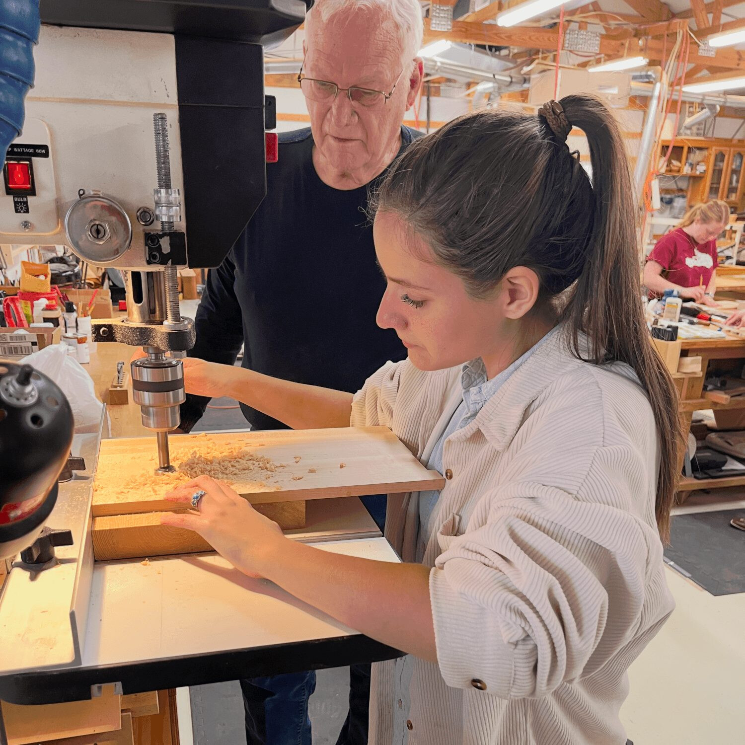 Girl learning woodworking