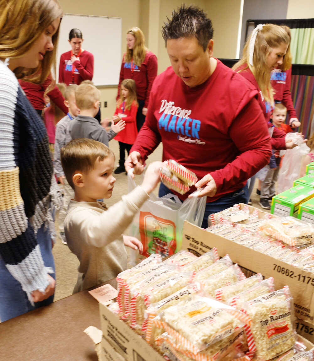 photo: students and teachers packing food supplies