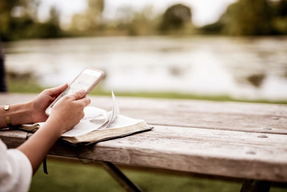 Person holding a smartphone and reading