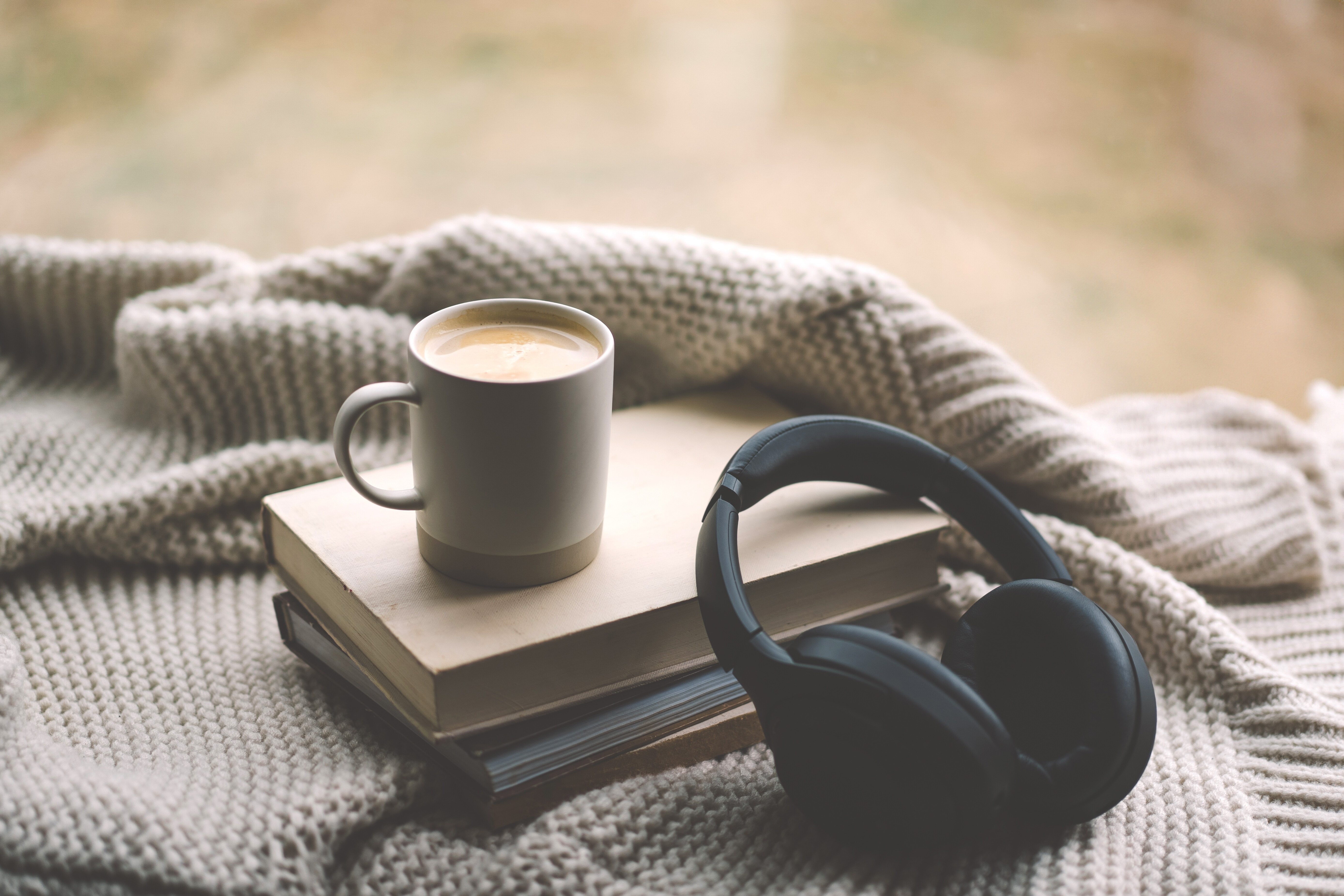 Stack of books and Bible on a table