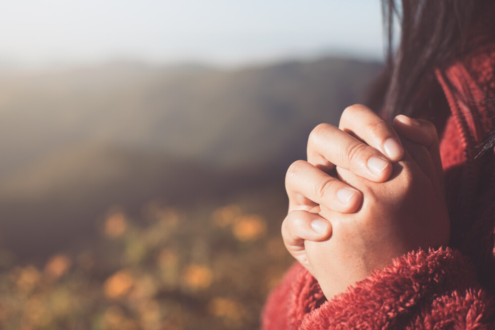 a-woman's-prayerful-hands