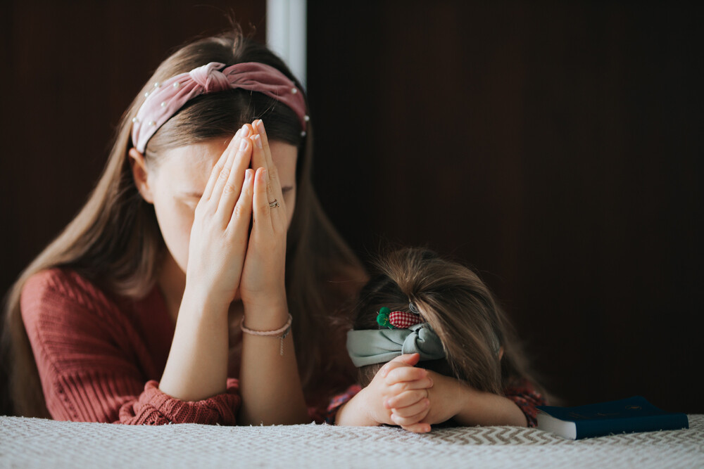 mom-and-daughter-praying-earnestly