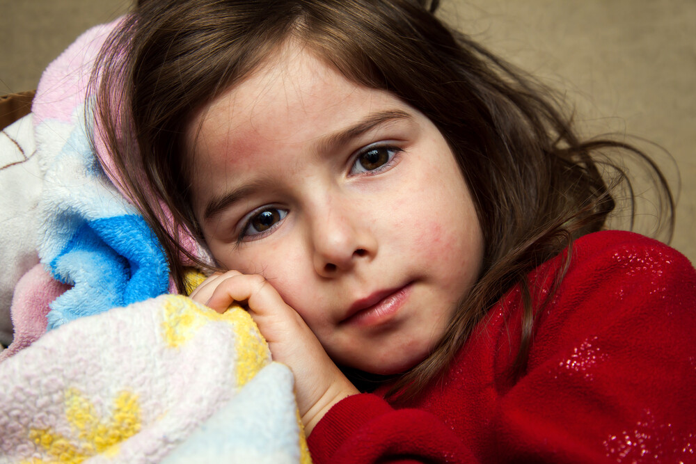 young-girl-cuddled-up-with-blankie