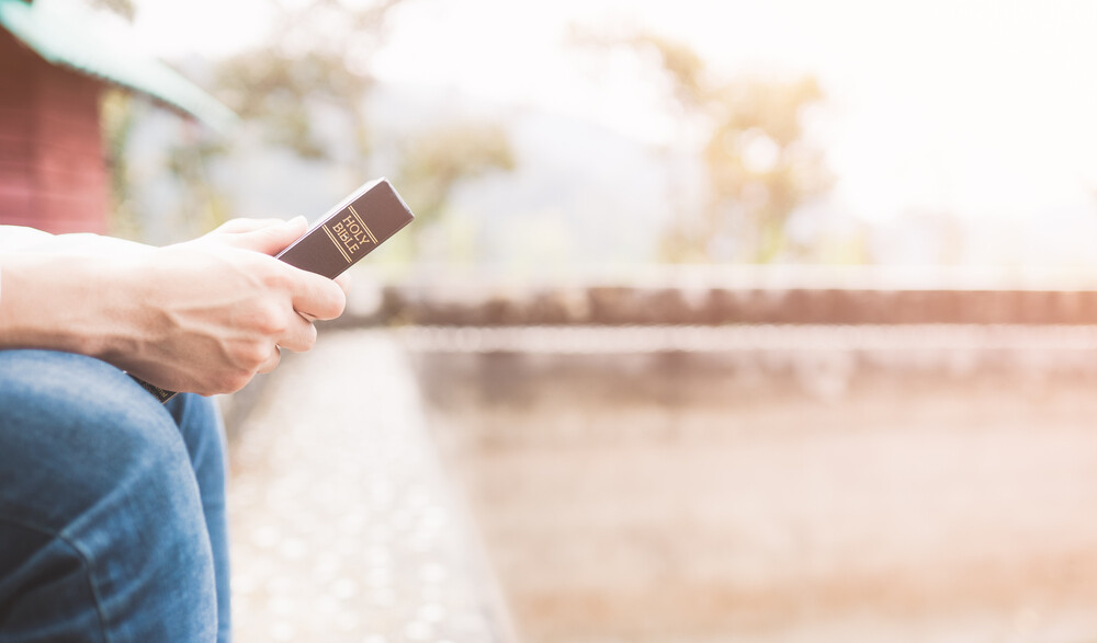 hands-of-man-holding-the-Holy-Bible