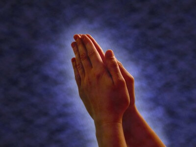 Praying Hands - hands clasped together in...