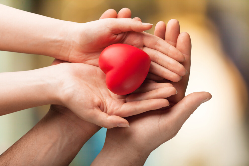 generosity-concept-open-hands-red-heart