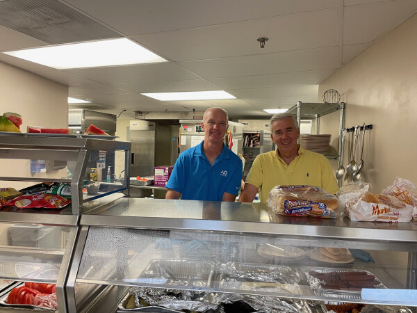 Marshall Scott and Bill Hunt serving food at the grassroots center