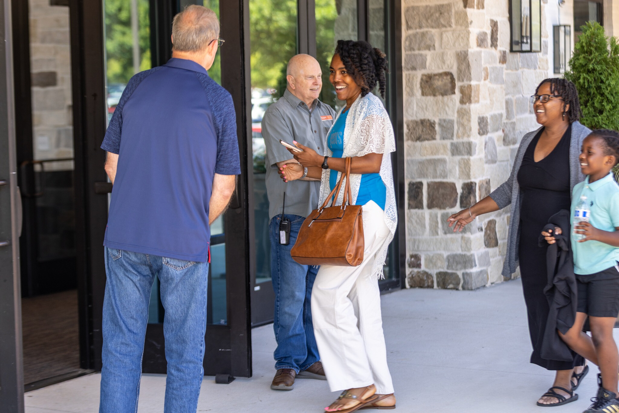 Friendly Greeters Opening the Doors for Guests