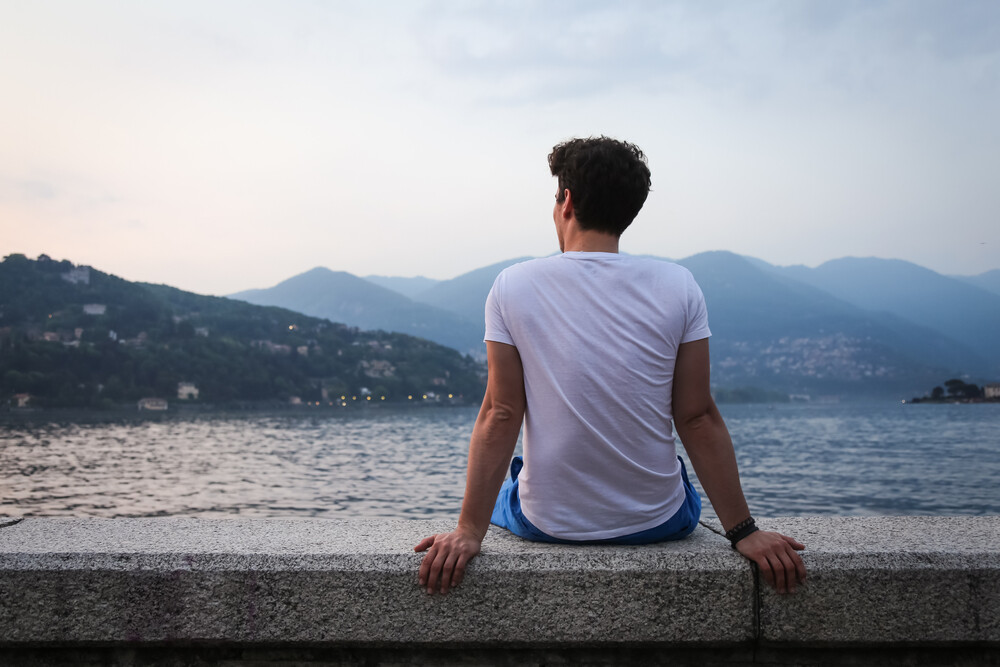 back-view-young-single-man-contemplating-life