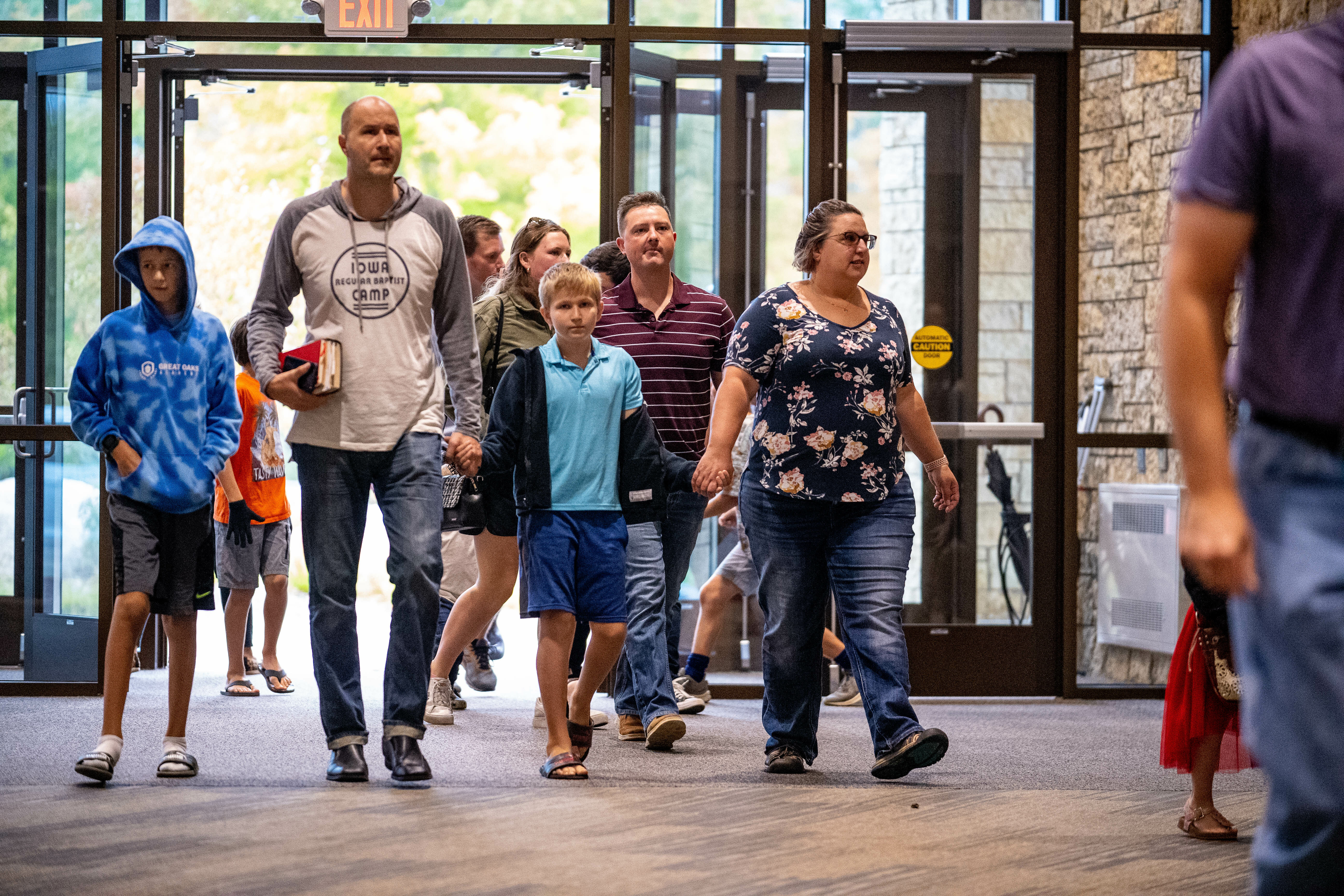 happy-family-eagerly-entering-church-building