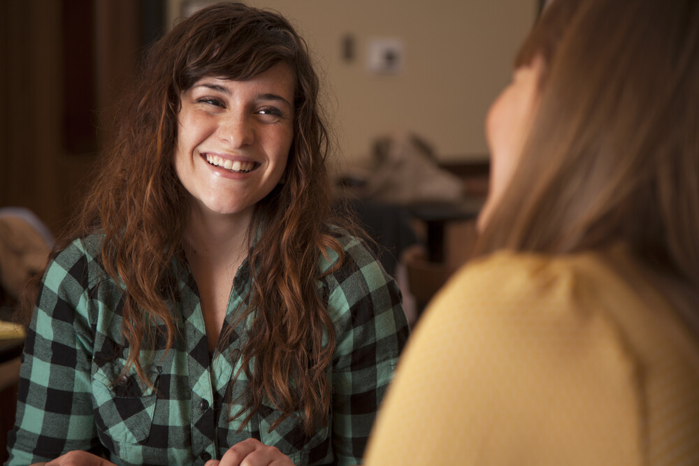 two-women-happily-interacting-with-each-other