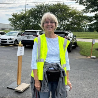 Volunteer with parking vest