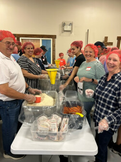 People preparing food at Rise Against Hunger