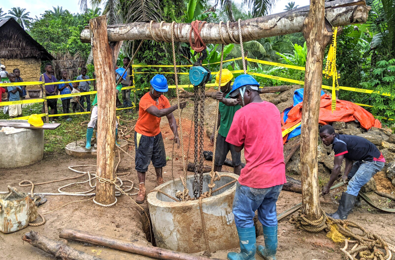 Clean drinking water project - men digging well