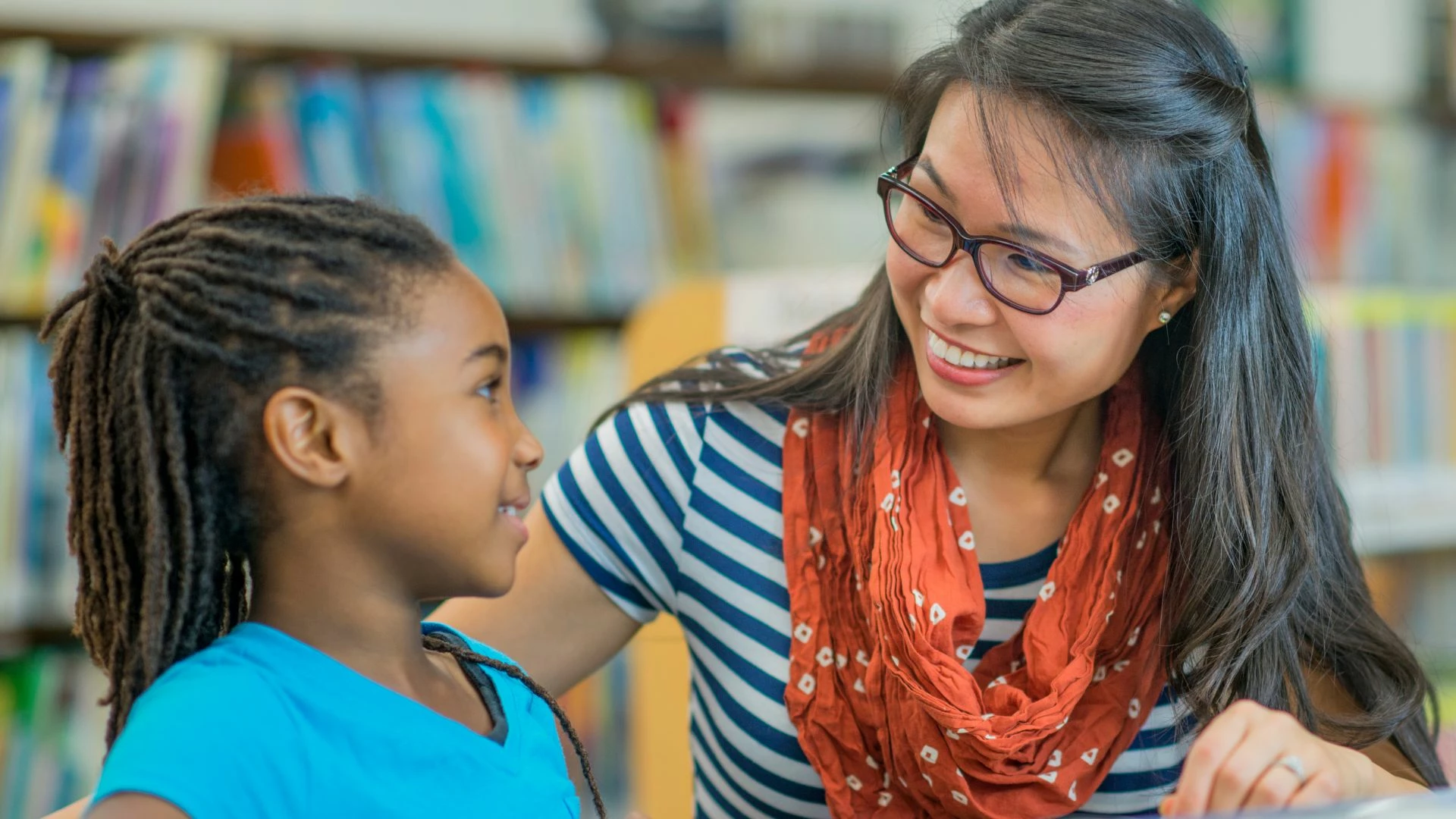 close-up-of-teacher-encouraging-a-young-student