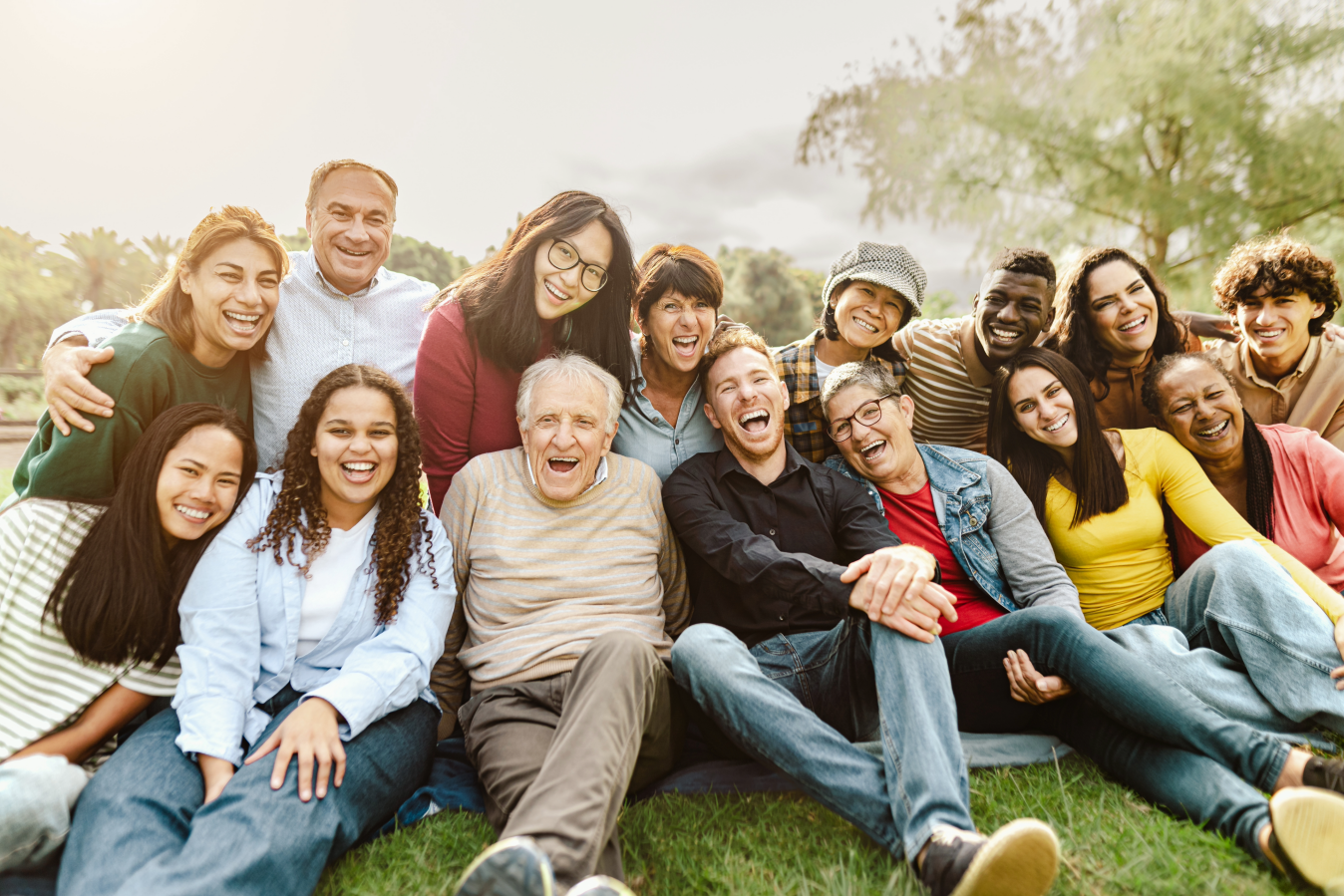 group of people sitting outside in a park