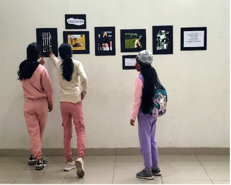 Students looking at the photo exhibit