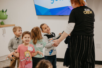 Volunteers sitting with kids