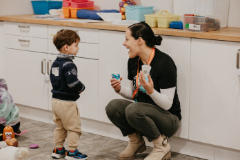 Volunteers sitting with kids