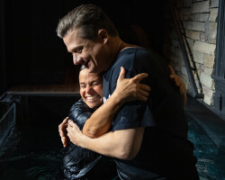 Two Adults Hugging After a Baptism