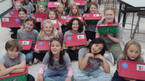 Students, families pack more than 100 OCC boxes