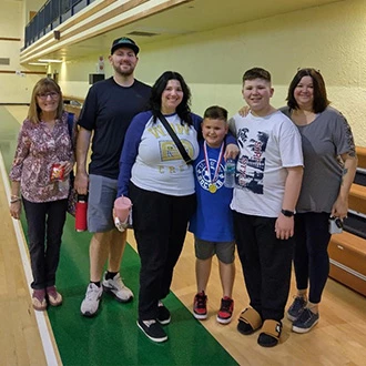 family supporting soccer player