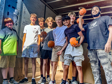 Students Unloading Pumpkins