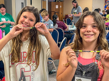 Teens crafting braclets