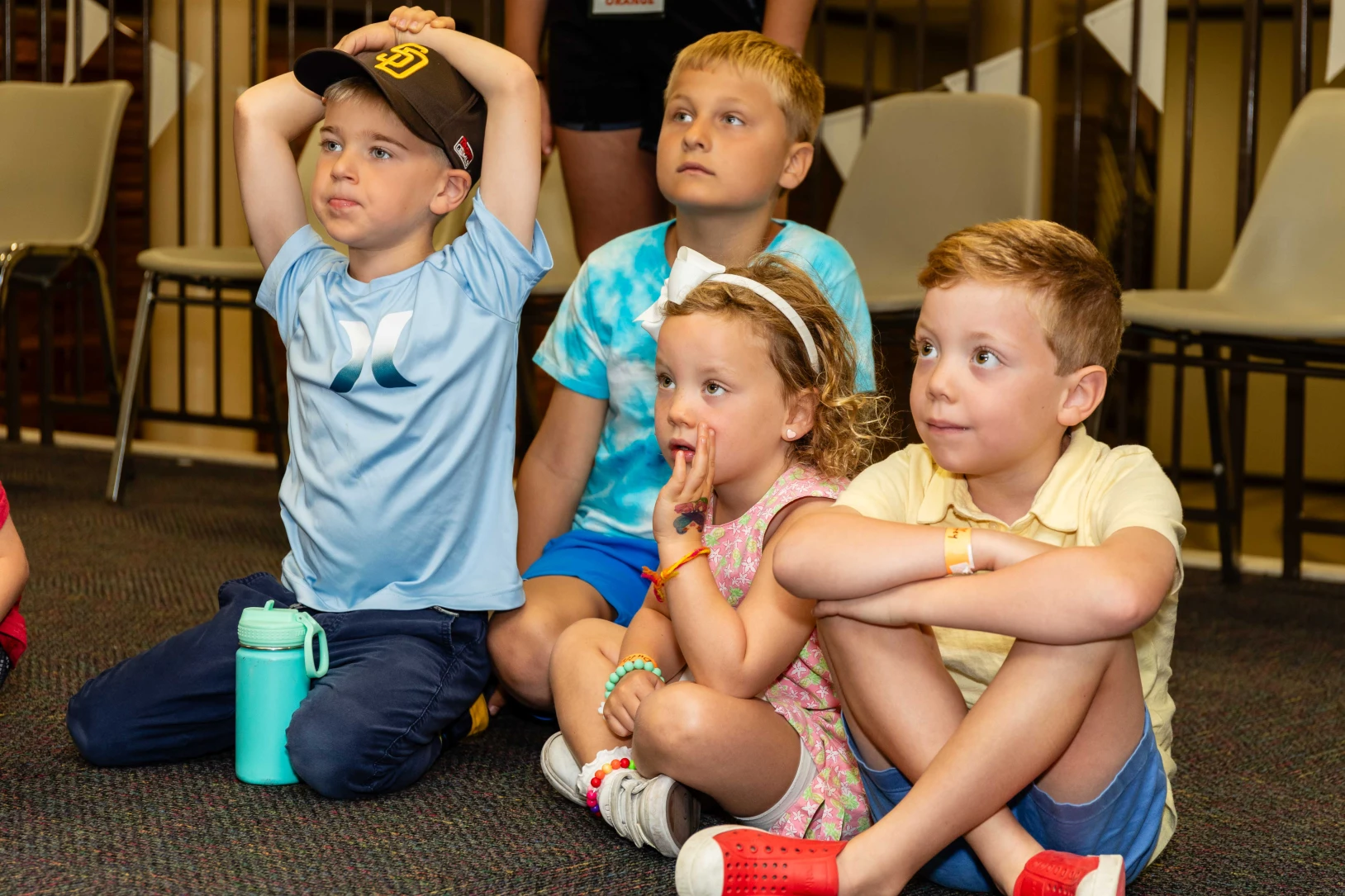 Children listen to a bible story during VBS.