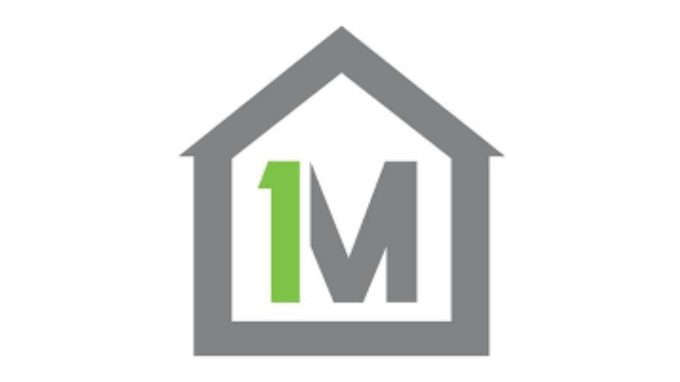 1Missions logo. Inside a grey  house outline is a green 1 and grey M connected