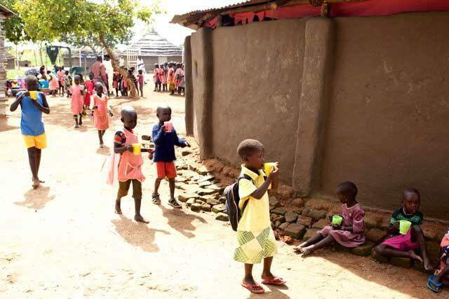 PEACE school children being fed