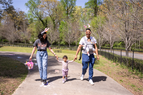 Family walking towards egg hunt.