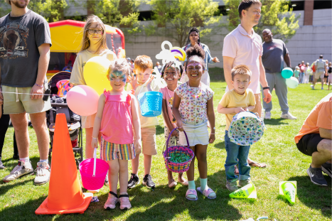 Group of kids smiling at egg hunt