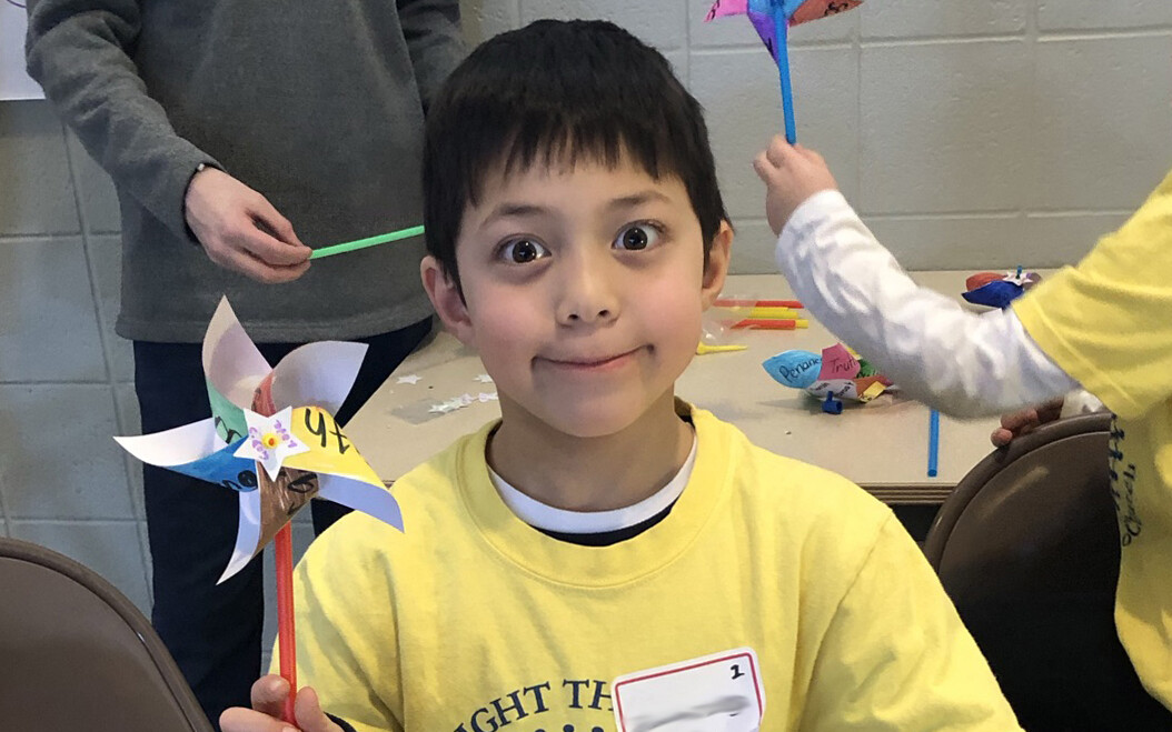 Student holding pinwheel