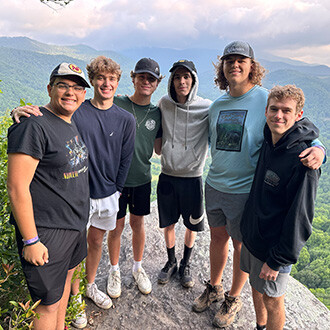 Group of students on mountain peak