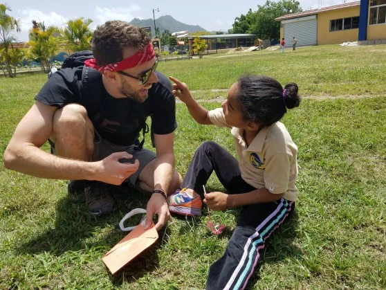 Man leading a sports team in the Dominican Republic.