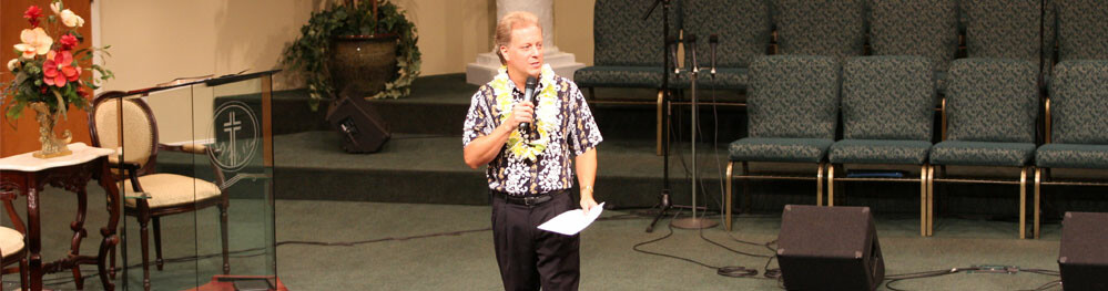 Banner-Pastor-preaching-Aloha-Day-2009