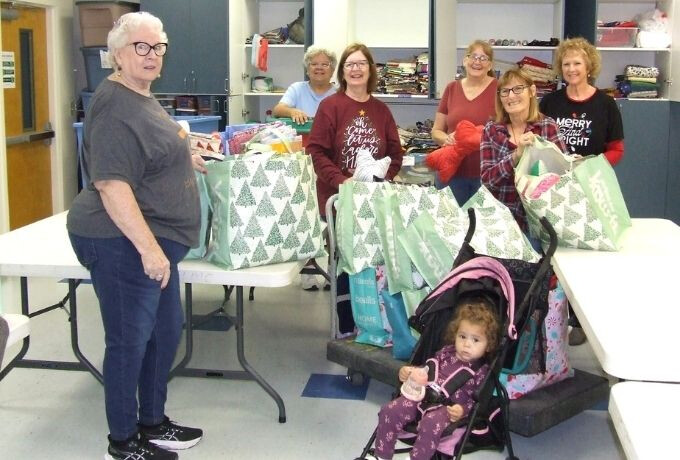 members of Dorcas circle with Christmas gifts for nursing home residents