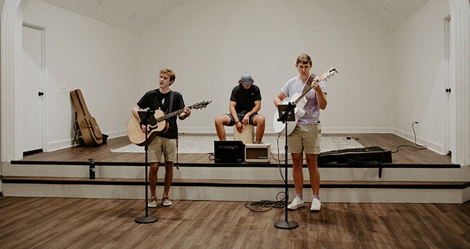 musicians playing at young adult worship