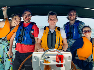 Young professional group outing sailing on Lake Michigan