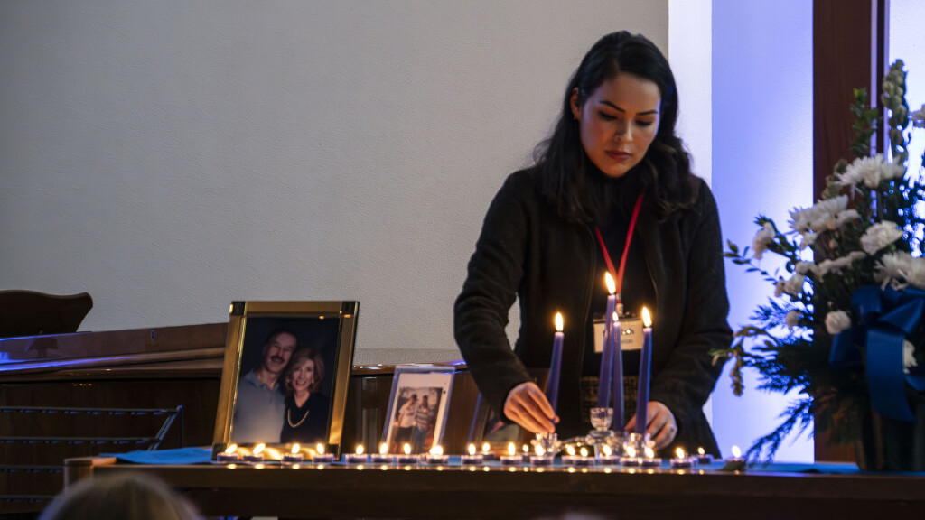 Candle lighting at memorial altar during Blue Christmas service