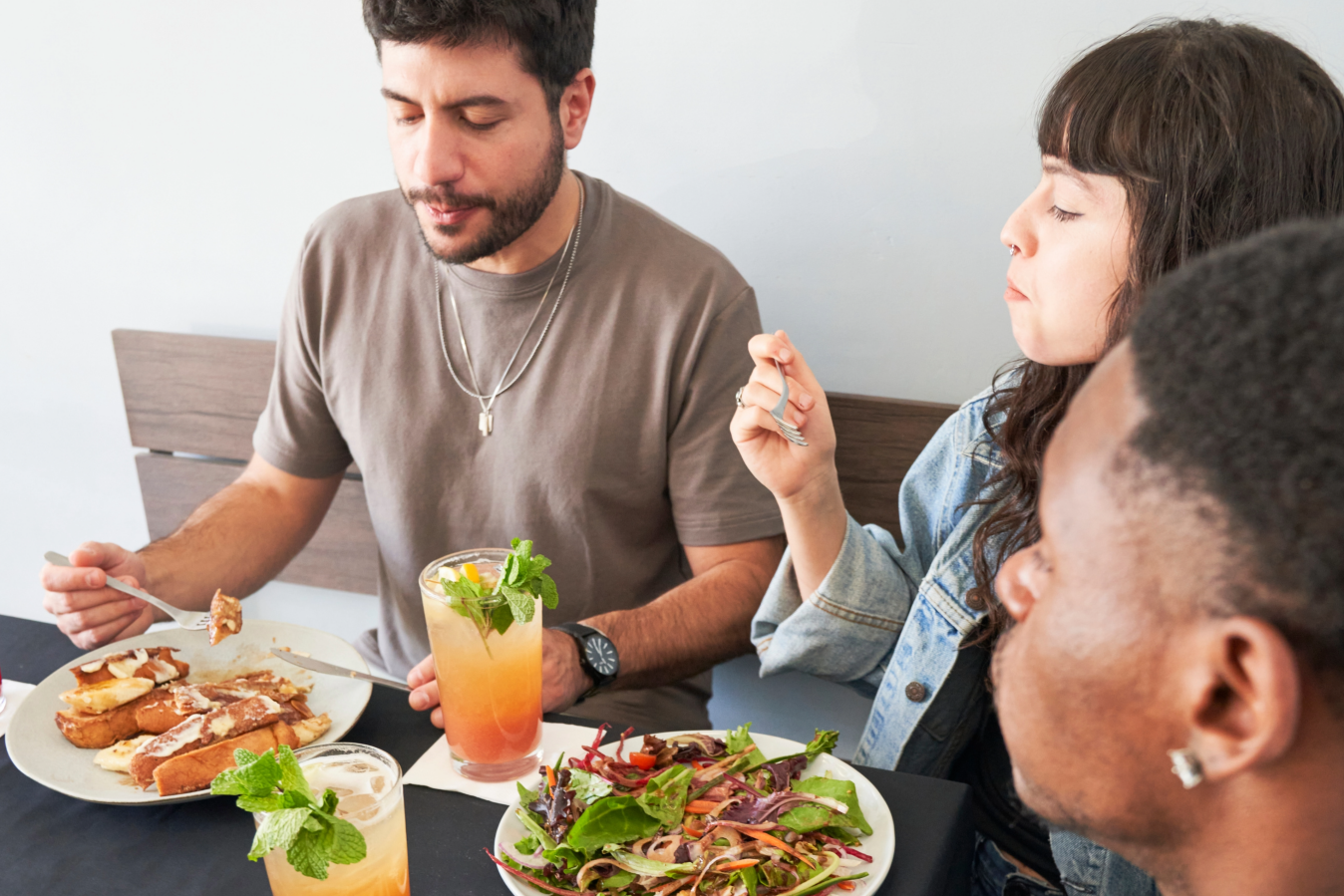 three people eating