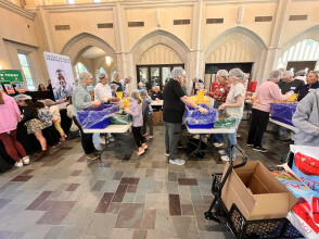Families packing food for the hungry