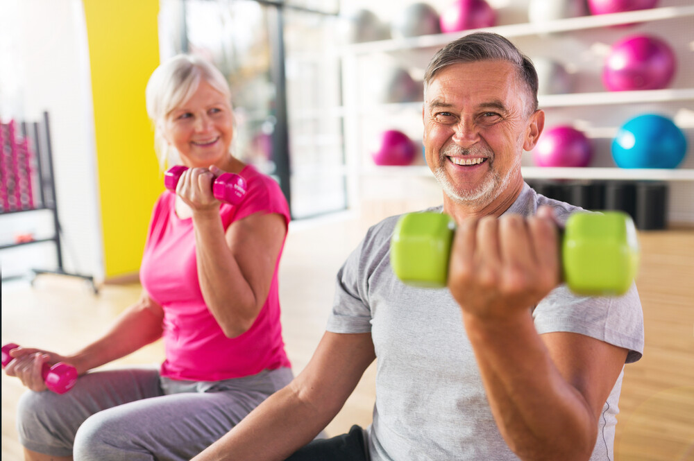 senior-couple-exercising-at-gym
