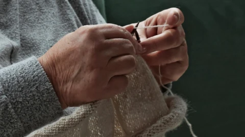 With Each Stitch
